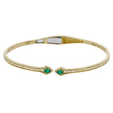 This modern hinged bangle adds a touch of color with two precious gemstone accent, set off by .30 ctw of white diamonds along the sides.