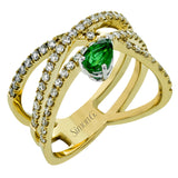 This modern right hand ring crafted in 18K gold features .61cttw white diamonds and a .39ct emerald.