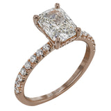 This distinctive bridal set design features a double-layer wedding band that fits around the engagement ring. The set contains .77 ctw of white diamonds.