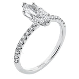This distinctive bridal set design features a double-layer wedding band that fits around the engagement ring. The set contains .77 ctw of white diamonds.