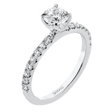 This distinctive bridal set design features a double-layer wedding band that fits around the engagement ring. The set contains .77 ctw of white diamonds.