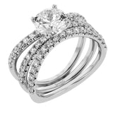 This distinctive bridal set design features a double-layer wedding band that fits around the engagement ring. The set contains .77 ctw of white diamonds.