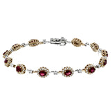 This 18K rose gold bracelet features 2.0 ctw of oval Rubies each surrounded by white diamonds 1.44 ctw., 7