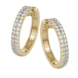 A full 1.00 ctw of round white diamonds form two rows of sparkle in these lovely 18k yellow gold hoop earrings.