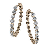 A modern take on a hoop earring, this lovely pair contain .99 ctw of sparkling white diamonds set in rose gold.