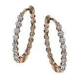 These classic rose gold hoops glimmer with .33 ctw of white diamonds