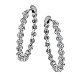 Dazzling yet refined, these white gold hoops showcase an impressive 1.51 ctw of white diamonds