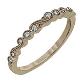 This vintage inspired 18k rose gold ring contains .12 ctw of round white diamonds in a delicate swirling design. Perfect for stacking.