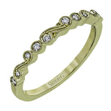 This vintage inspired 18k yellow gold ring contains .12 ctw of round white diamonds in a delicate swirling design. Perfect for stacking.