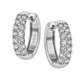 The clean design of these white gold earrings is elevated by 1.05 ctw of sparkling round white diamonds
