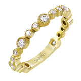 This lovely 18k yellow gold band showcases varied sizes of round white diamonds that total .30 ctw. Perfect for stacking.