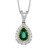 This elegant, vintage-inspired pendant glimmers with .28 ctw of round white diamonds and a .72 ctw pear shaped emerald, all set in sophisticated two-tone gold.