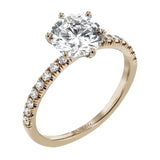 This distinctive bridal set design features a double-layer wedding band that fits around the engagement ring. The set contains .77 ctw of white diamonds.