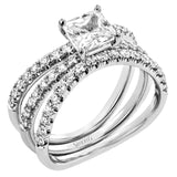 This distinctive bridal set design features a double-layer wedding band that fits around the engagement ring. The set contains .77 ctw of white diamonds.