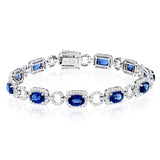 This 18k white gold bracelet is an instant heirloom with 9.06 ctw of blue sapphires and 2.21 ctw of round brilliant white diamonds.