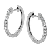 These classic hoop earrings are crafted from 18k white gold and set with .25 ctw of shining white diamonds.