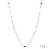 1.75 MM Emerald and 1/6 Ctw Round Cut Diamond Precious Station Necklace in 14K White Gold