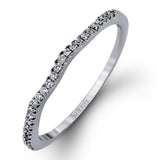 Featuring a modern design, this rose and white gold engagement ring and wedding band is highlighted by .51 ctw of round cut white diamonds.
