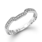 The dramatic contemporary design of this white gold ring is highlighted by .59 ctw of round cut white diamonds and .36 ctw princess cut diamonds.