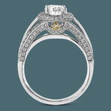 This lovely 18k white gold engagement ring design is created for an elegant oval center stone and features .77 ctw of white diamonds accented by a small touch of .03 ctw of yellow diamonds.