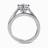 The elegant design of this classic white gold engagement ring and wedding band is complemented by .21 ctw of glimmering round cut white diamonds.