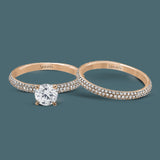 Reflecting a simple yet elegant classic design, this white gold engagement ring and band is accented by .86 ctw white diamonds.