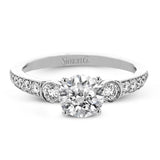 This Roxy Collection engagement ring takes inspiration from the past but updates it into a perfect design featuring .40 ctw of white side diamonds.