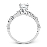 This remarkable set provides the looks of three rings, with a yellow gold ring guard set with yellow diamonds that encompasses the center white gold engagement ring.