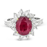 A 2.53 ct ruby glows in the center of a swirl of 1.20 ctw of marquise diamonds in this specialty gemstone ring.
