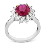 A 2.53 ct ruby glows in the center of a swirl of 1.20 ctw of marquise diamonds in this specialty gemstone ring.