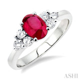 7x5mm Oval Cut Ruby and 1/3 ctw Round Cut Diamond Ring in 14K White Gold