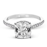 This 18K engagement ring from our under halo collection evokes understated elegance, with 0.30 ctw of delicate diamonds on the shank, the lower halo, and the bridge.