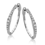 Dress up your classic button down with these 18K white gold hoops featuring .97cttw diamonds.
