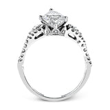 Reflecting an intricate modern design, this remarkable white gold ring is emphasized by a lovely halo complemented with .59 ctw round cut white diamonds.