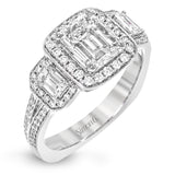 This impressive white gold ring features .43 ctw emerald cut side diamonds and is accented with .38 ctw round cut diamonds.