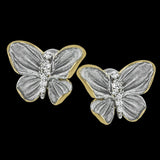 These butterfly stud earrings are set with .10 ctw of white diamonds and feature both gray and yellow gold.