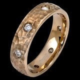 The classic hammered design of this men's yellow gold band is elevated with contemporary accents of .55 ctw round cut white diamond insets.